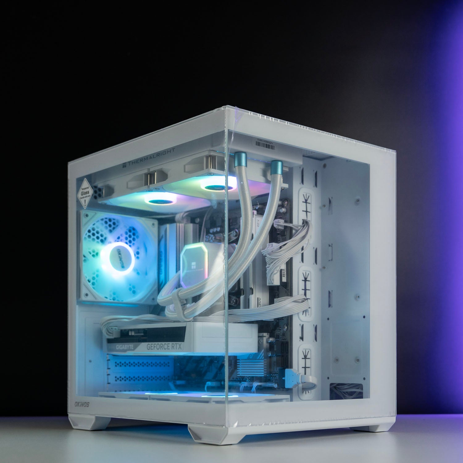 White AMD custom gaming PC with RGB lighting – Ryzen 5 7500F with NVIDIA RTX 5060 8GB, 32GB DDR5, 1TB SSD in Okinos Mirage 4 case, designed for smooth 1080p and 1440p gaming in Australia.