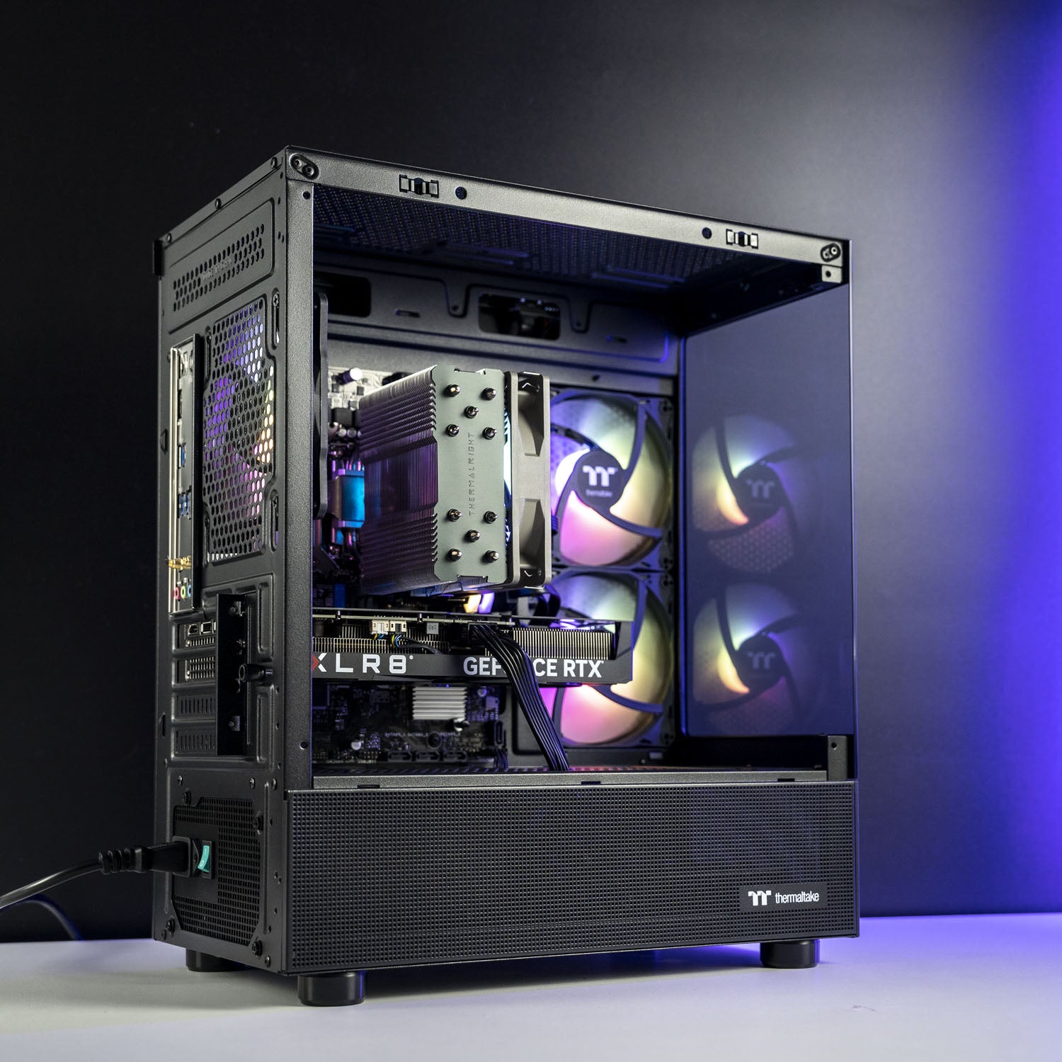 Open computer case with visible hardware components. Black AMD custom gaming PC with RGB lighting – Ryzen 7 5700X with NVIDIA RTX 5050 8GB, 32GB DDR4, 1TB SSD in Thermaltake View 170 case, designed for smooth 1080p and 1440p gaming in Australia