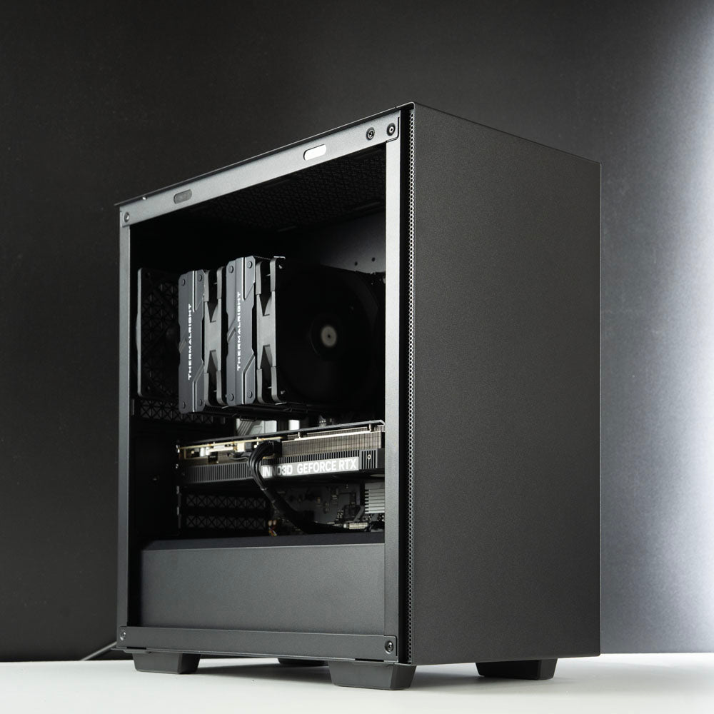 Minimalistic black AMD custom gaming PC – Ryzen 7 7800X3D with NVIDIA RTX 5070 Ti 16GB, 32GB DDR5, 2TB SSD in Deepcool Macube 110 case, designed for smooth 1440p and 4K gaming in Australia with a clean and modern look.