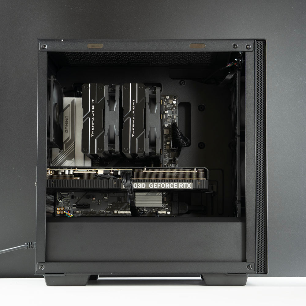 Minimalistic black AMD custom gaming PC – Ryzen 7 7800X3D with NVIDIA RTX 5070 Ti 16GB, 32GB DDR5, 2TB SSD in Deepcool Macube 110 case, designed for smooth 1440p and 4K gaming in Australia with a clean and modern look.