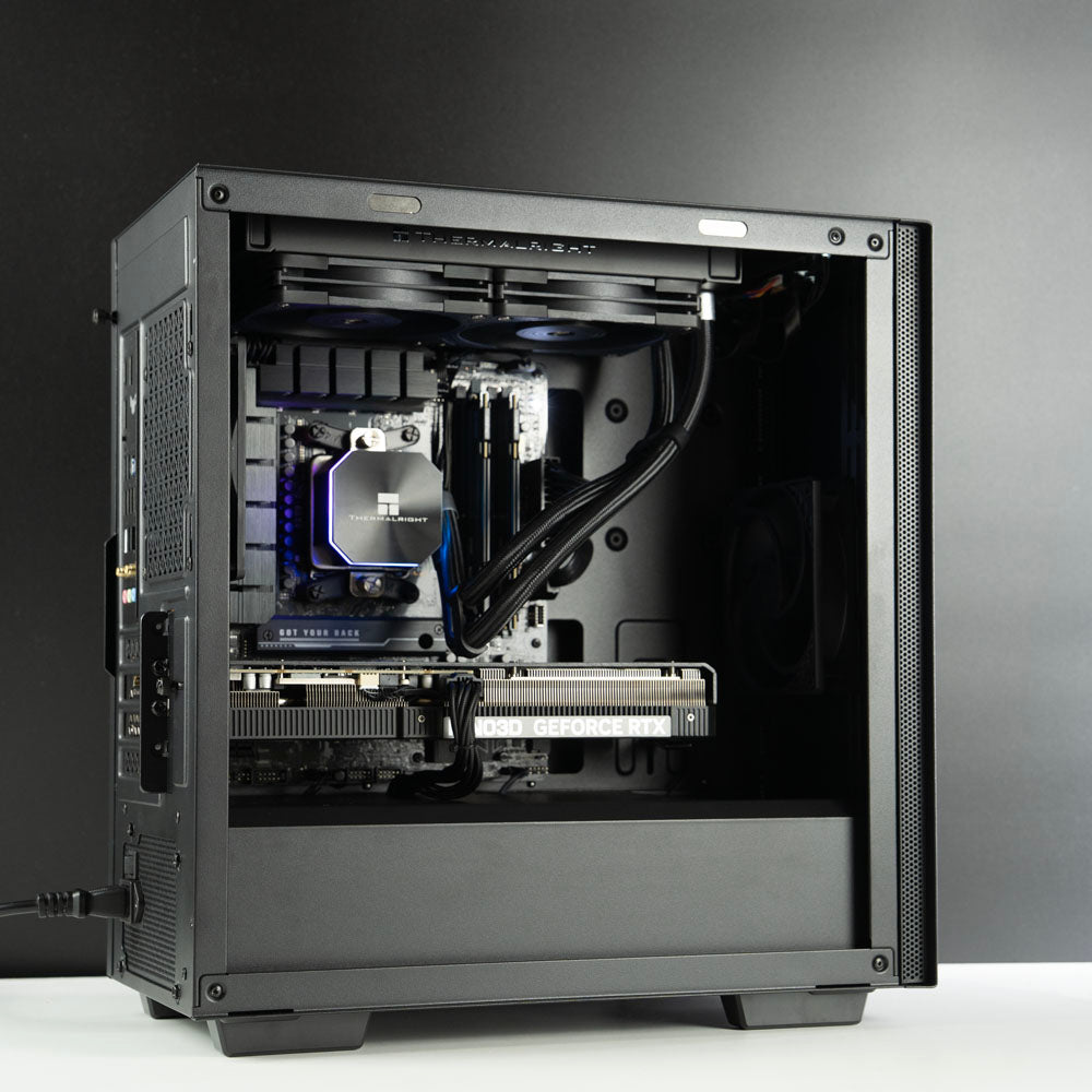 Minimalistic black AMD custom gaming PC with RGB lighting – Ryzen 7 7800X3D with NVIDIA RTX 5070 Ti 16GB, 32GB DDR5, 2TB SSD and 240mm liquid cooler in Deepcool Macube 110 case, designed for smooth 1440p and 4K gaming in Australia with a clean modern look.