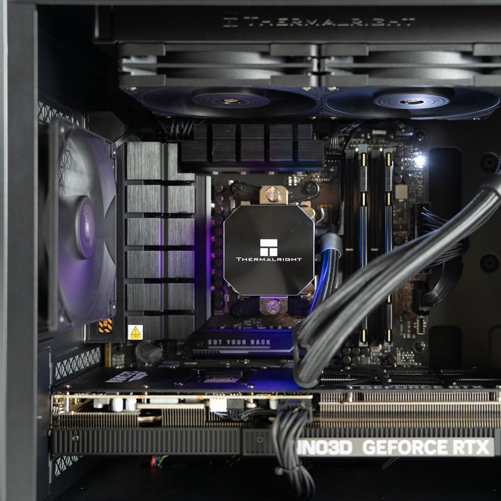 Minimalistic black AMD custom gaming PC with RGB lighting – Ryzen 7 7800X3D with NVIDIA RTX 5070 Ti 16GB, 32GB DDR5, 2TB SSD and 240mm liquid cooler in Deepcool Macube 110 case, designed for smooth 1440p and 4K gaming in Australia with a clean modern look.