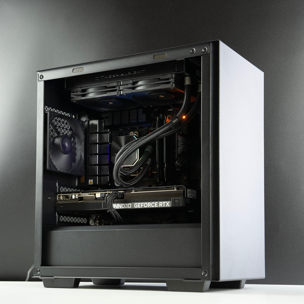 Minimalistic black AMD custom gaming PC with RGB lighting – Ryzen 7 7800X3D with NVIDIA RTX 5070 Ti 16GB, 32GB DDR5, 2TB SSD and 240mm liquid cooler in Deepcool Macube 110 case, designed for smooth 1440p and 4K gaming in Australia with a clean modern look.