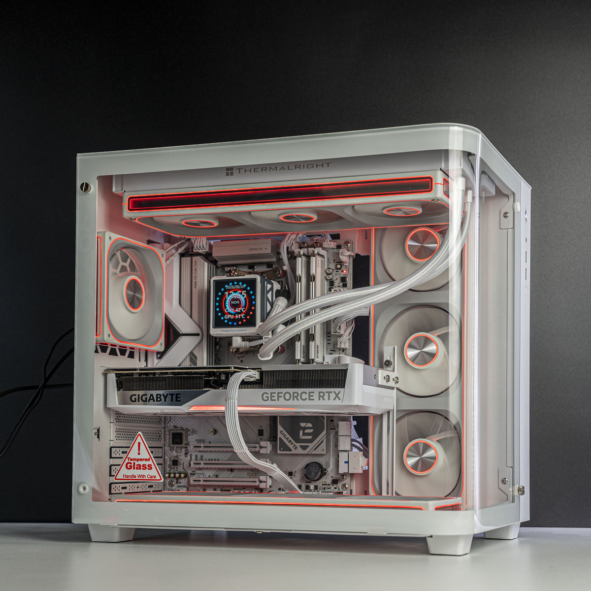 Jonsbo TK-3 case open showing white Gigabyte RTX 5070 Ti 16GB installed