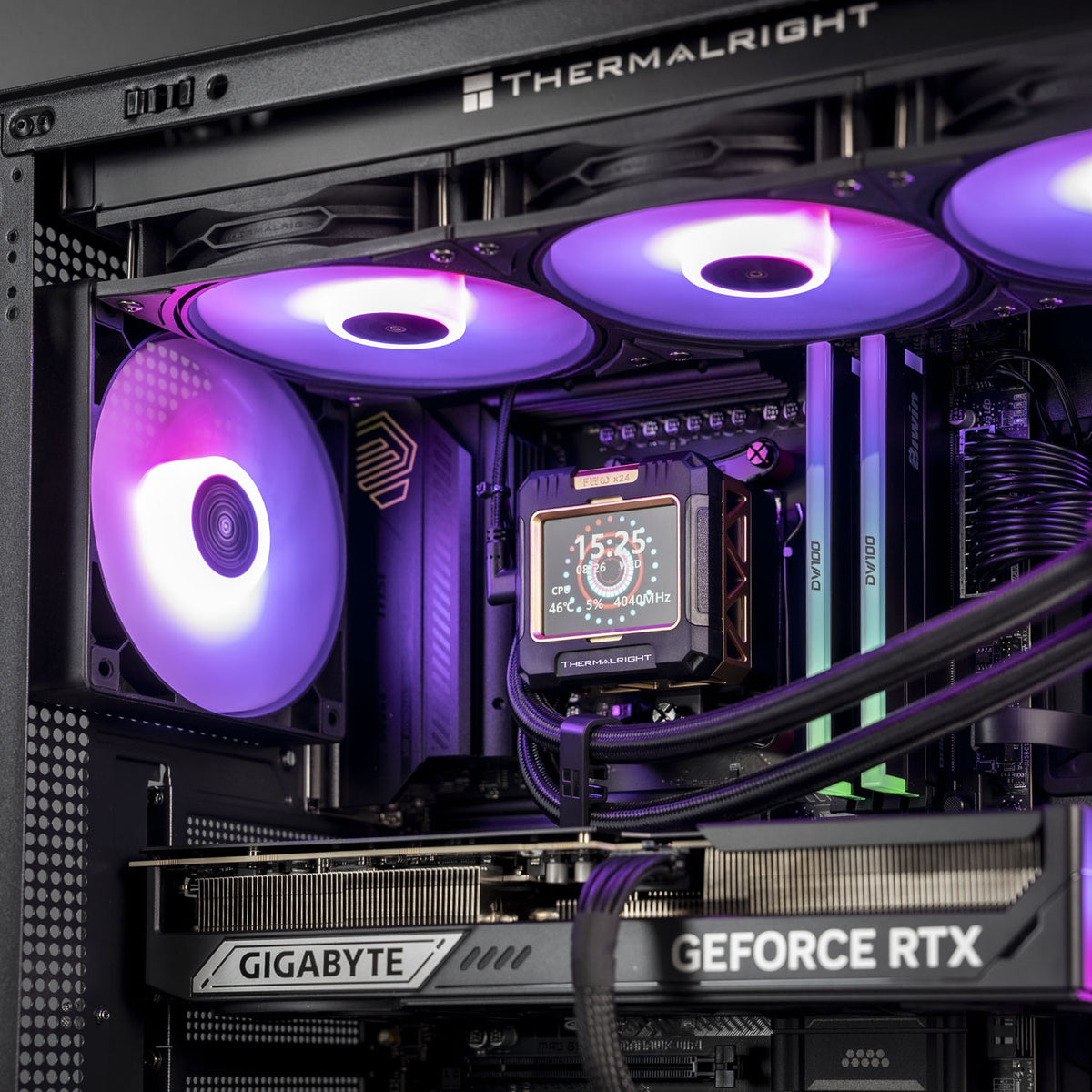 Close-up of a high-performance PC interior with a Thermalright liquid cooler, RGB fans glowing purple, a Gigabyte RTX graphics card, and RAM modules.